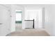 Bright upstairs hallway has neutral carpeting and white doors, with glimpses into other rooms in the house at 15977 Red Bud Dr, Parker, CO 80134