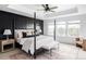 Luxurious main bedroom with tray ceiling, accent wall, and windows offering lots of natural light at 15977 Red Bud Dr, Parker, CO 80134