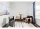 Bright home office with modern decor, large window, and comfortable seating is ideal for working from home at 15977 Red Bud Dr, Parker, CO 80134
