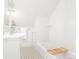 Bright bathroom featuring a classic black and white tile floor, white fixtures, and subway tile at 2211 W 33Rd Ave, Denver, CO 80211