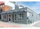 Exterior view of Western Daughters Butcher Shoppe in a mixed-use building on a clear day at 2211 W 33Rd Ave, Denver, CO 80211