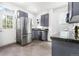Well-lit kitchen with modern appliances, granite countertops, and a convenient back door entrance at 2211 W 33Rd Ave, Denver, CO 80211
