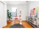 Bright home office with hardwood floors, a modern desk, artwork, and a large window at 2211 W 33Rd Ave, Denver, CO 80211