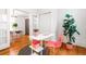 Bright office space with white walls, wooden floors, and a modern desk and plant at 2211 W 33Rd Ave, Denver, CO 80211