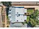 Aerial view of a multi-story home showcasing a well-maintained roof and a lush, green backyard at 493 S Lincoln St, Denver, CO 80209