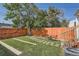 A fenced backyard with a seating area and a pathway of stepping stones through the grass at 493 S Lincoln St, Denver, CO 80209