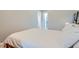 Neutral bedroom with white walls, soft lighting, and hardwood floors exudes a calm atmosphere at 493 S Lincoln St, Denver, CO 80209