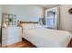 Cozy bedroom with hardwood floors, natural light, and neutral decor offers a relaxing retreat at 493 S Lincoln St, Denver, CO 80209