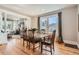 Elegant dining room with a large window, hardwood floors, and a classic wooden table set at 493 S Lincoln St, Denver, CO 80209