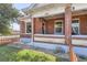 Charming brick home with covered front porch, landscaped yard, and street appeal, perfect for curb appeal at 493 S Lincoln St, Denver, CO 80209