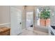 Clean kitchen area offering stainless steel appliances, bright lighting, and convenient laundry access at 493 S Lincoln St, Denver, CO 80209
