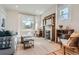 Bright living room showcasing a decorative window, stylish furniture, and beautiful fireplace at 493 S Lincoln St, Denver, CO 80209