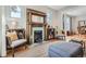 Inviting living room featuring a charming fireplace, hardwood floors, and comfortable seating at 493 S Lincoln St, Denver, CO 80209