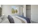 Inviting bedroom features a cozy bed, natural light, and a neutral color scheme, creating a tranquil atmosphere at 13770 Emerald Lake St, Parker, CO 80138