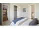 Comfortable bedroom boasts neutral tones, a closet, and serene decor for ultimate relaxation and peaceful rest at 13770 Emerald Lake St, Parker, CO 80138