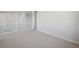 Bright bedroom with neutral walls, white trim, carpeted floor, and access to the hallway at 13770 Emerald Lake St, Parker, CO 80138