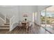Well-lit dining area features a round table, stylish chairs, and modern design at 13770 Emerald Lake St, Parker, CO 80138