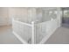 Bright hallway with white railings, doors, carpeted floor, and a modern chandelier at 13770 Emerald Lake St, Parker, CO 80138