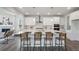 Bright kitchen boasts stainless steel appliances, a large island, and a seamless layout at 13770 Emerald Lake St, Parker, CO 80138