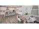 Spacious kitchen featuring white cabinets, a large island, and modern appliances at 13770 Emerald Lake St, Parker, CO 80138