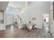 Open-concept living area showcases a staircase, high ceilings, and sleek hardwood floors at 13770 Emerald Lake St, Parker, CO 80138