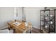 Bright office space features a rustic desk, shelving, and a comfortable chair at 13770 Emerald Lake St, Parker, CO 80138