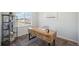 Comfortable home office features a unique desk, shelving, and a view to the neighborhood at 13770 Emerald Lake St, Parker, CO 80138
