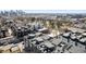 Stunning aerial view showcasing modern townhomes with rooftop decks in a vibrant city setting at 2321 Eliot St, Denver, CO 80211