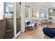 Cozy living area with access to a private balcony and views of the outdoors at 2321 Eliot St, Denver, CO 80211