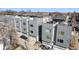 Modern townhome exteriors with sleek design, featuring private garages and contemporary finishes at 2321 Eliot St, Denver, CO 80211