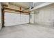 Spacious unfinished garage with ample room for parking and storage solutions at 2321 Eliot St, Denver, CO 80211