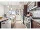 Bright kitchen with stainless steel appliances and a large window providing plenty of natural light at 2321 Eliot St, Denver, CO 80211