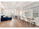 Bright living room with hardwood floors, comfortable seating, and a sliding glass door at 2321 Eliot St, Denver, CO 80211