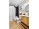 Bathroom featuring marble tile, new sink, gold fixtures, and a walk-in shower at 201 Wright St # 106, Lakewood, CO 80228