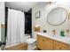 Bathroom featuring marble tile, new sink, gold fixtures, and a walk-in shower at 201 Wright St # 106, Lakewood, CO 80228