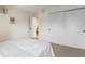 Bedroom featuring plush carpet and sliding closet doors at 201 Wright St # 106, Lakewood, CO 80228