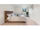 Bright bedroom features a large window and a calming color palette with neutral decor at 201 Wright St # 106, Lakewood, CO 80228