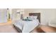 This light-filled bedroom features cozy bedding and a spacious closet for ample storage at 201 Wright St # 106, Lakewood, CO 80228