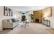 Inviting living room with stone fireplace, modern furnishings, and sliding glass doors at 201 Wright St # 106, Lakewood, CO 80228