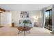 Comfortable living room with neutral carpet, sliding glass doors, and modern artwork at 201 Wright St # 106, Lakewood, CO 80228