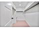 Bright walk-in closet with ample shelving and hanging space for organized storage at 201 Wright St # 106, Lakewood, CO 80228