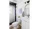 Modern bathroom with sleek fixtures, stylish black and white tile, and a bright sink vanity at 13055 E Dakota Ave, Aurora, CO 80012