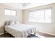 Bright bedroom features a comfortable queen size bed, ceiling fan, and lots of natural light at 13055 E Dakota Ave, Aurora, CO 80012