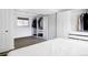 A bright bedroom featuring custom closets and wood floors offer an organized, modern and spacious retreat at 13055 E Dakota Ave, Aurora, CO 80012
