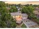 Charming home featuring a spacious deck, landscaped yard, and inviting curb appeal at 13055 E Dakota Ave, Aurora, CO 80012