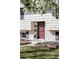 A charming home front showcases a decorative red door, brick accents, and curb appeal at 13055 E Dakota Ave, Aurora, CO 80012
