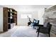 Cozy living space with built-in shelving, a modern Peloton bike, and stylish seating is perfect for relaxation and fitness at 13055 E Dakota Ave, Aurora, CO 80012