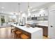 Well-equipped kitchen with quartz countertops, stainless steel appliances, and island seating at 2179 S Bannock St, Denver, CO 80223