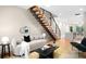 Inviting living room with staircase, wood floors, and contemporary décor at 2179 S Bannock St, Denver, CO 80223