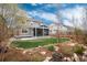This home features a beautiful landscaped backyard, complete with a screened in porch and a healthy lawn at 7844 Grady Cir, Castle Rock, CO 80108